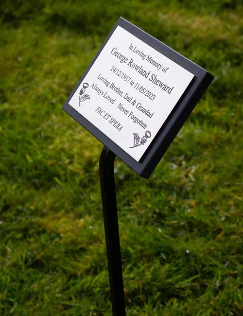 This plaque was attached to a cotian backing board on a wrought iron tree stake. Stainless Steel Memorial Plaque