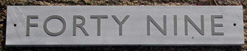 slate sign with raised letters