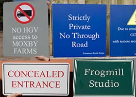 A range of sign boards in various materials.