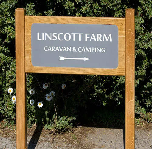 This sign was made usins oak with inlaid slate corian Superior Entrance Sign