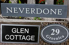 Slate, granite and other stone signs.