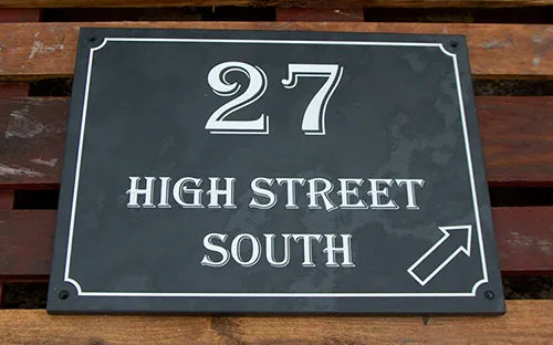 This slate house sign also has a border Slate Address Sign with Arrow