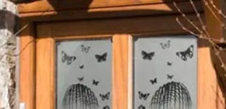 Window with frosted vinyl applied