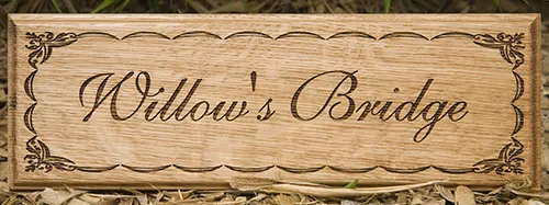 title here Wooden sign with fine lettering and detailed border