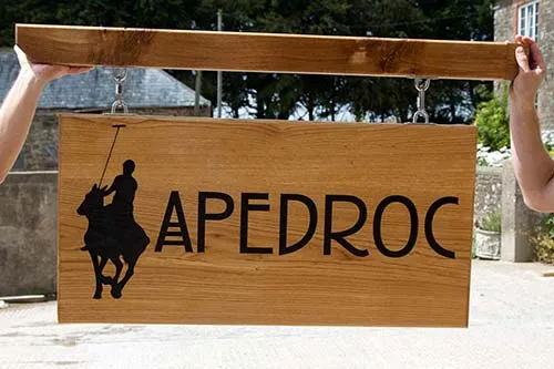 This sign was made to hang from Post and Arm Large Oak Sign