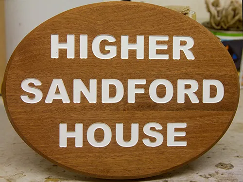 Oval wooden house sign