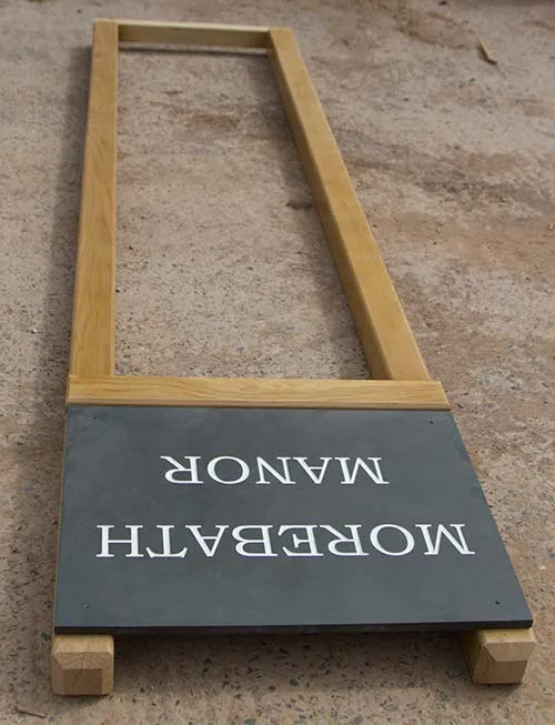 An extra support bar was added as slate is a heavy material. Slate Sign With Oak Posts