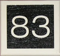 title here Raised wooden house number