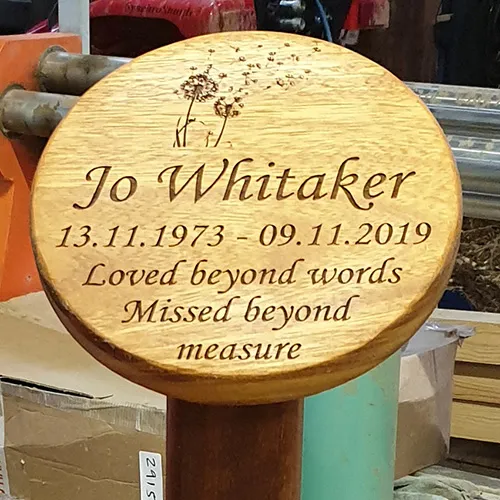 title here Round wooden memorial plaque
