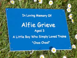 Blue laminate memorial with white text.
