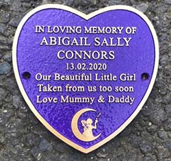 Heart shaped bronze childrens memorial plaque.