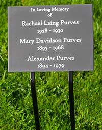 Engraved corian plaque on double spike tree stake.