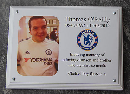 Full colour memorial plaque on white backing board.
