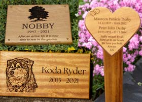 Wooden memorials icluding wooden crosses, plaques, hearts and memorials on posts.