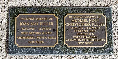 Cast bronze plaques on granite plinth.
