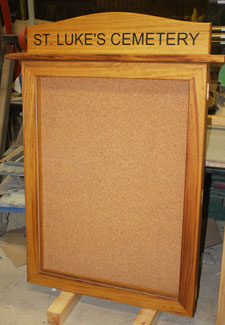 Iroko Notice Board with header and stainess steel fittings