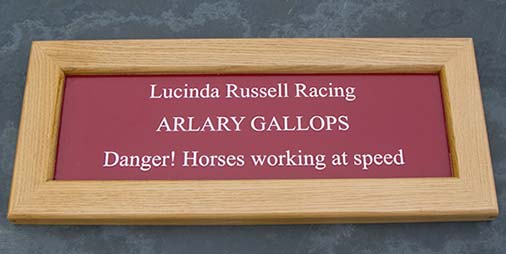 Small oak framed business sign.