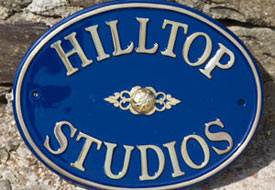 Oval cast brass house sign.