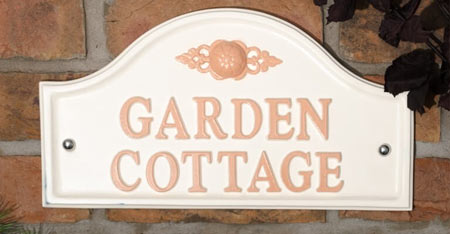 Cream arch top cast aluminium name plate.