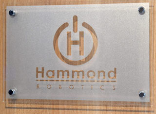 Clear acrylic with sandblast effect text.