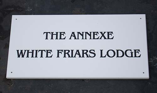 Engraved White Corian.