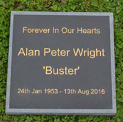 Black granite memorial with a sand-blasted border edge.