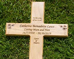 Engraved wooden memorial cross.