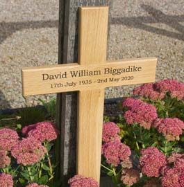 Simple oak memorial cross.