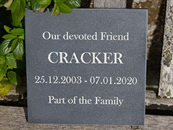 Engraved stone-like corian memorial plaque.