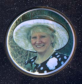 Round porcelain photo memorial plaque.