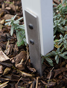 Painted wooden cross with stainless steel bar.