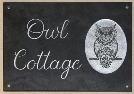 Slate house sign with detailed image.
