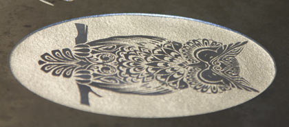 Close-up showing the inlaid panel with the laser etched image.