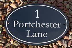 Oval slate sign painted and laseed.