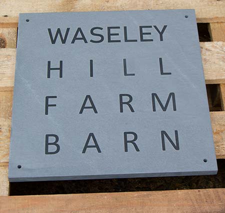 Slate sign with raised letters designed as customer requested.