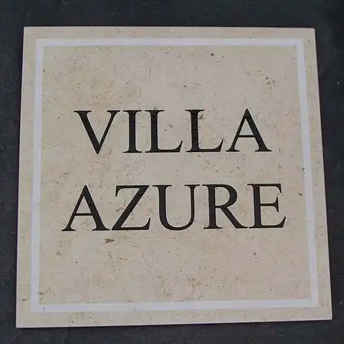 This ign has an unpainted engraved border. Limestone House Sign