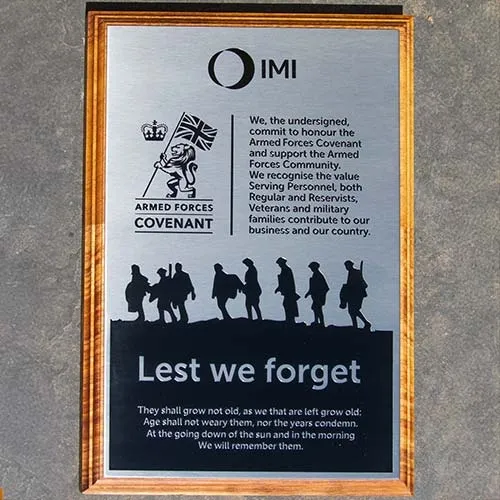 Armed forces memorial on a backing board Lest We Forget