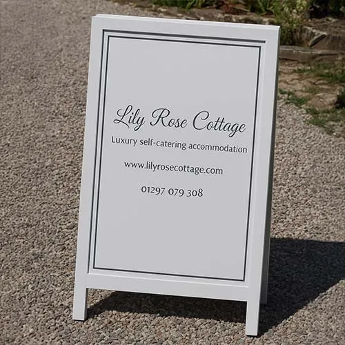 The panel is made from very durable Tricoya. Painted harwood frame with painted lettering