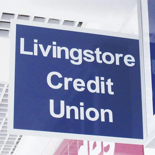 White sign with dark blue cut vinyl Folded aluminium wall mounted projecting sign with 40mm return edge