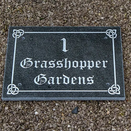 This address sign was made on dark grey granite and has a Celtic Border. Larger House Number Sign