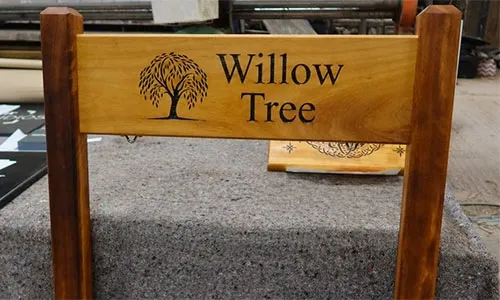 The iroko sign has been morticed into the iroko posts. Iroko Wood Entrance Sign
