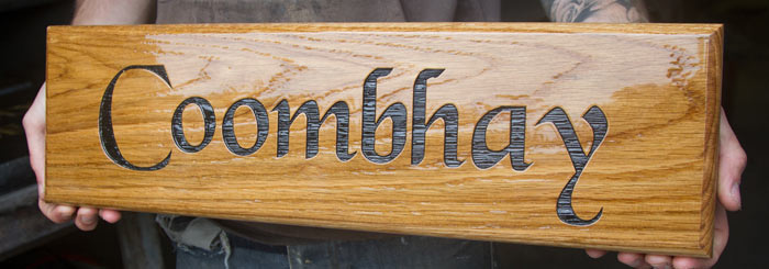 Wooden sign treated with coach enamel.