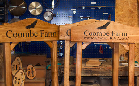 Front fixed arch topped farm signs.