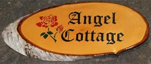 Rustic house sign with coloured rose
